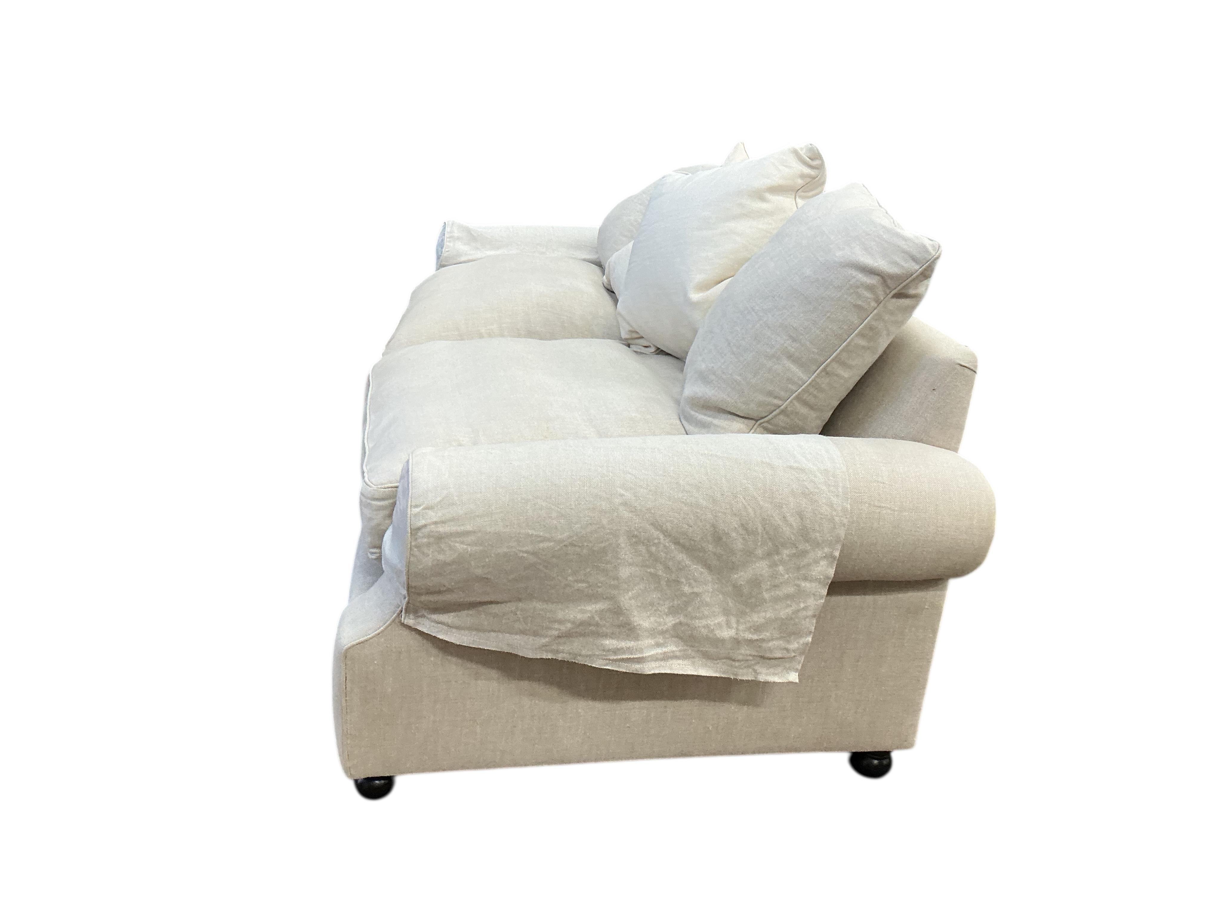 A Contemporary three seater sofa upholstered in natural fabric, width 220cm, depth 100cm, height 90cm